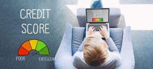 Excellent Credit Score with man using a laptop