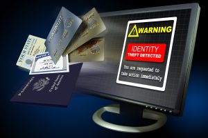 Image of Computer with Warning statement about Identity Theft, credit card and passport Id is shown