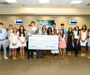 scholarship check presented to students by ceo/president of Spencer Savings Bank